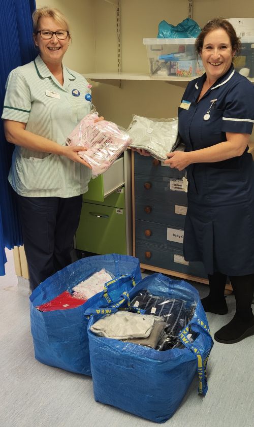 Staff unpacking donation of clothes